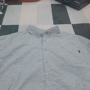 Short sleeve green button up.